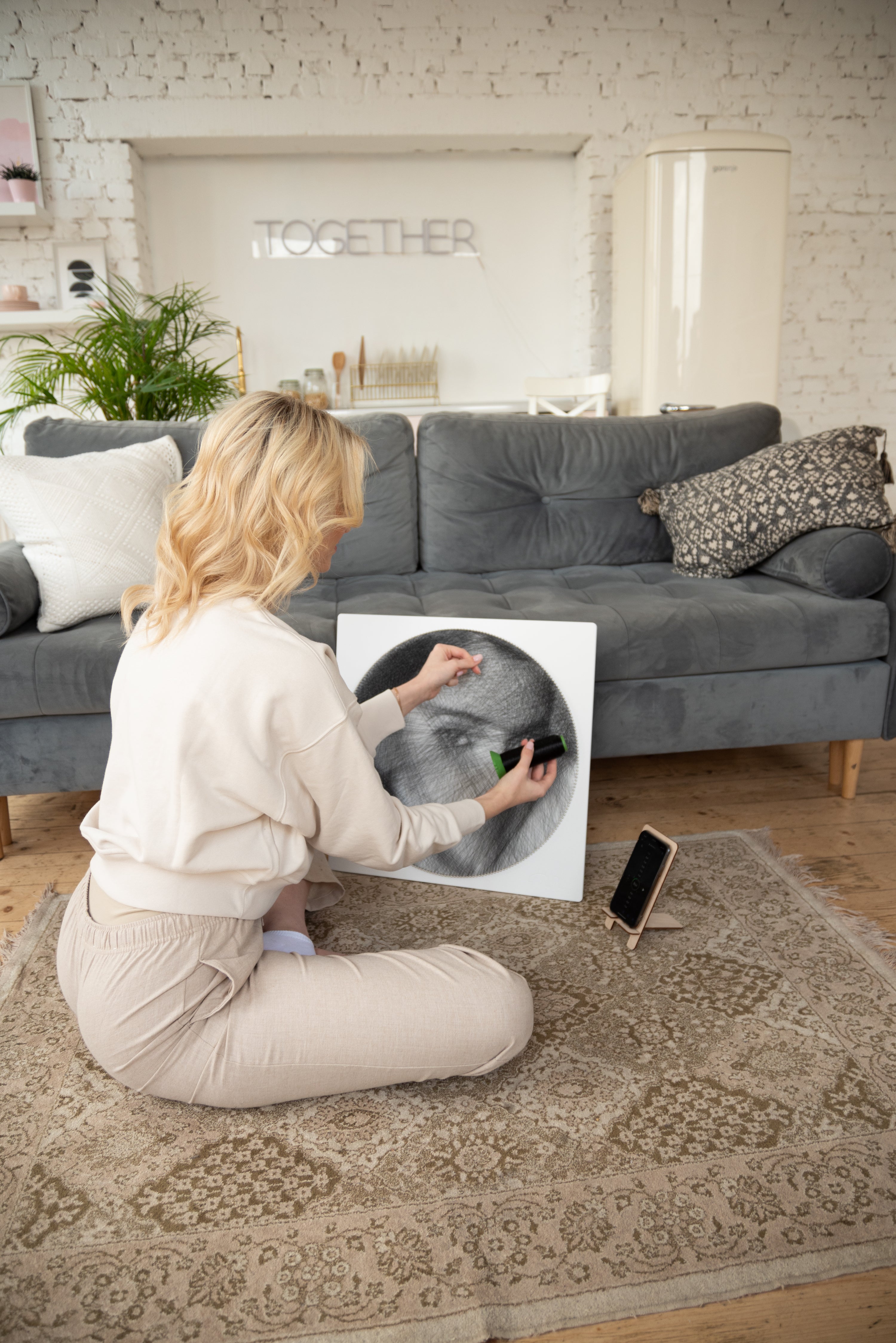 RingString Woman assembling a portrait